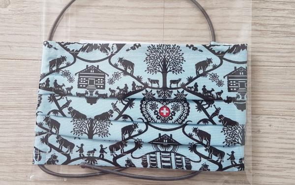 wiederverwendbare Mund-Nasen-Maske im Scherenschnitt Design blau