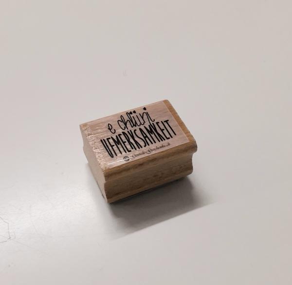 Holzstempel e chliini Ufmerksamkeit